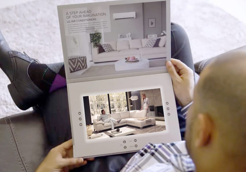 Man Holding Custom 10-inch Video Brochure Los Angeles