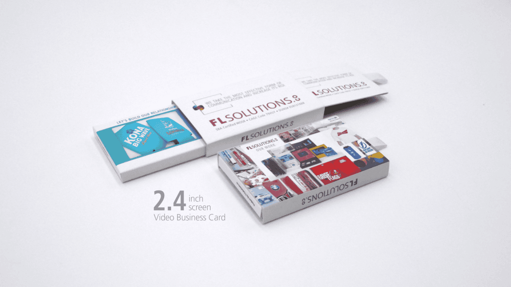 Compact 2.4-inch screen video business cards from FL Solutions on a white background, showcasing custom branding and multimedia capabilities.